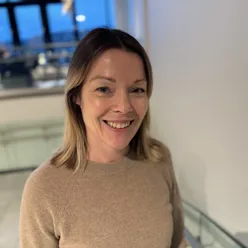 A woman smiling for the camera
