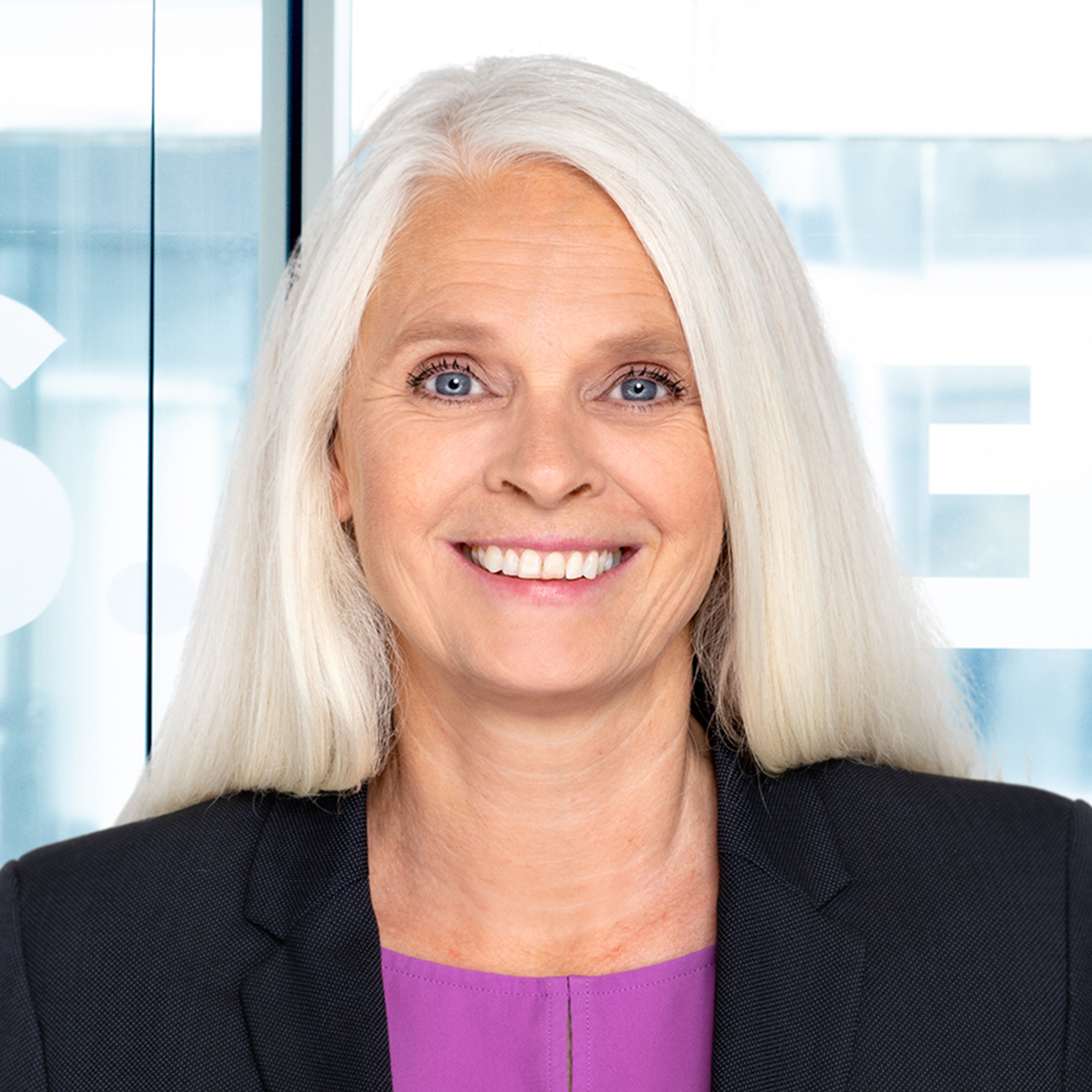 A woman smiling for the camera