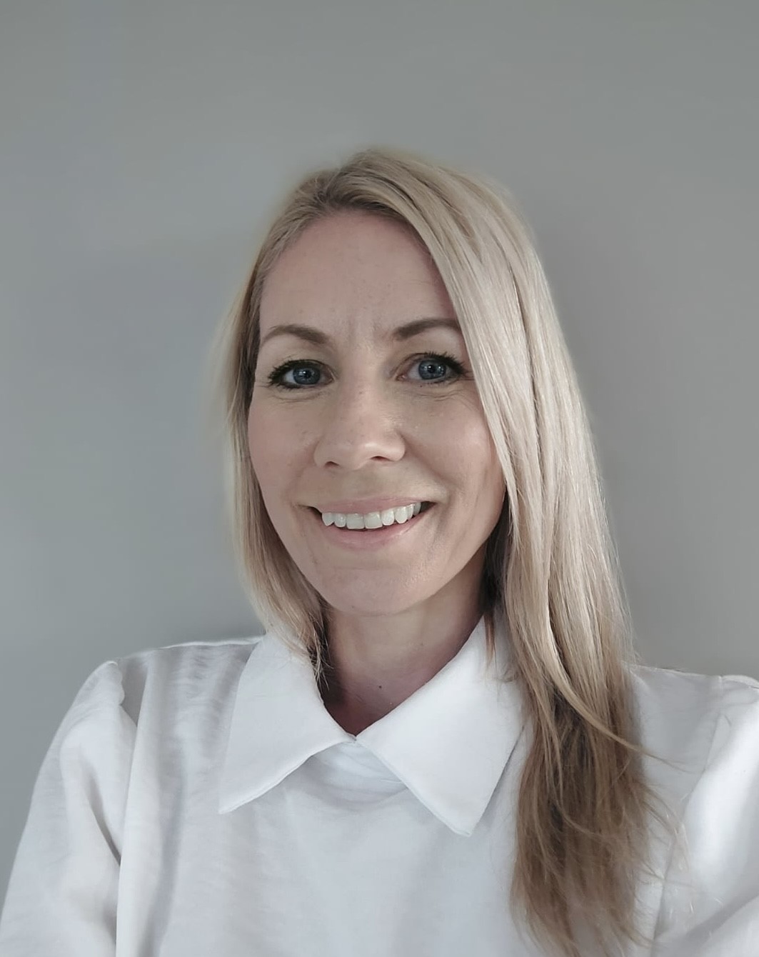 A woman smiling for the camera