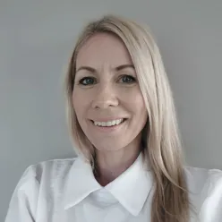 A woman smiling for the camera