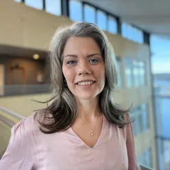A woman smiling for the camera
