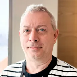 A man wearing a striped shirt