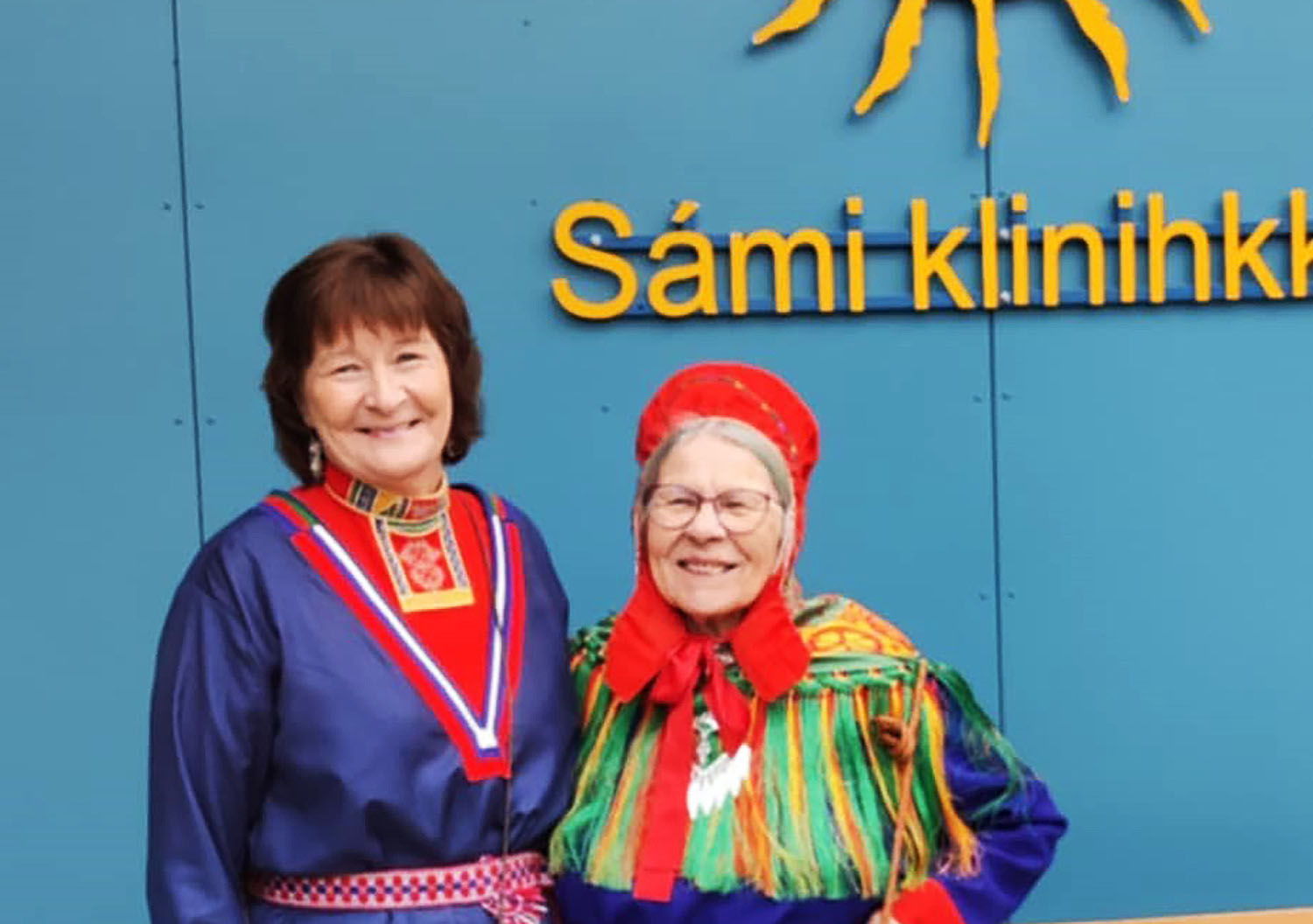 A couple of women smiling