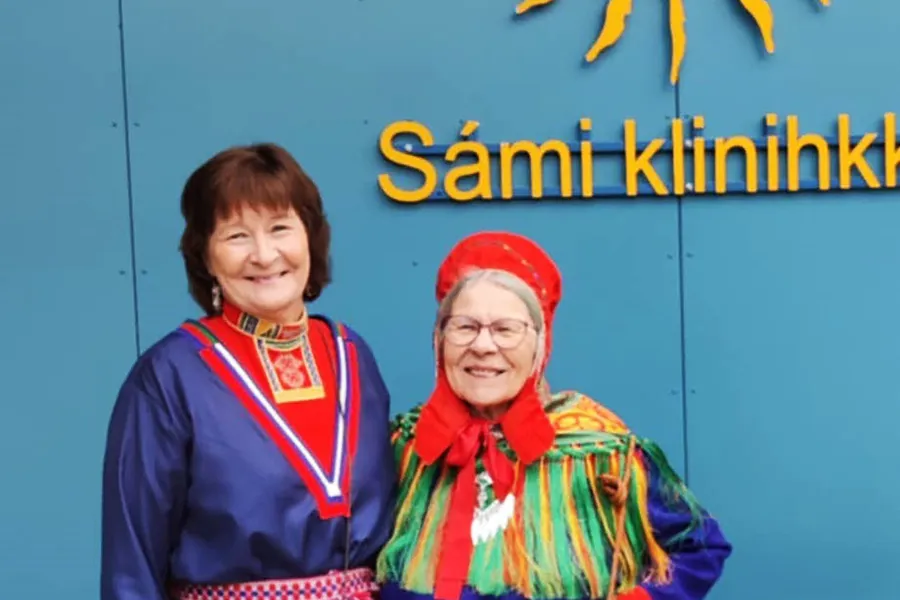 A couple of women smiling