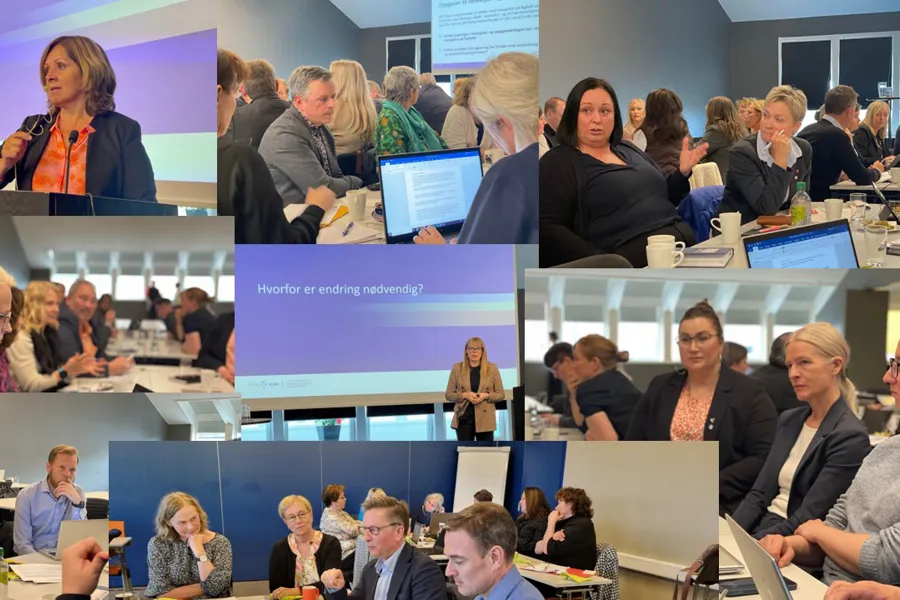 En gruppe mennesker som sitter i et rom med datamaskiner