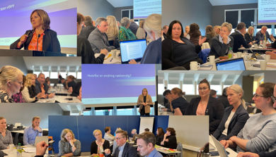 En gruppe mennesker som sitter i et rom med datamaskiner