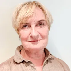 A close-up of a person smiling