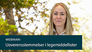 En kvinne som smiler til kameraet